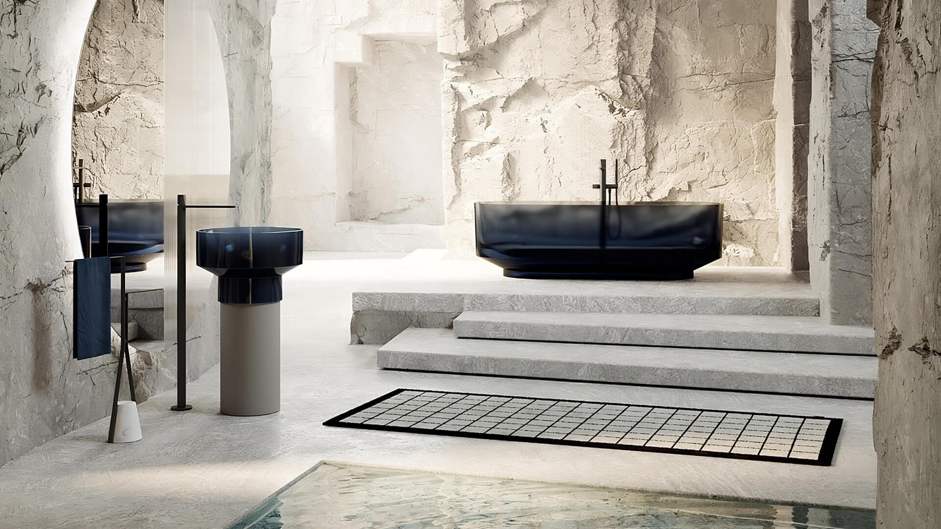 antoniolupi bathroom interior with stone surfaces and a freestanding basin